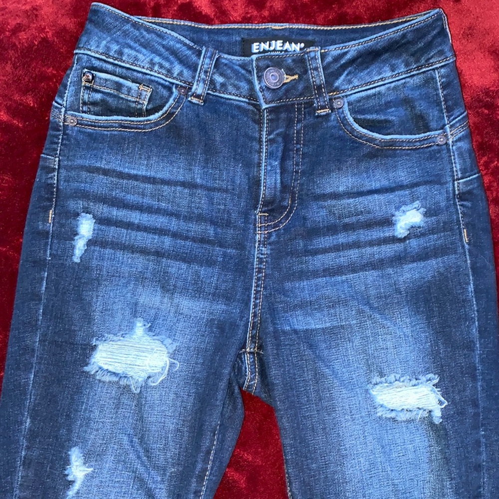 Skinny light distressed dark blue jeans